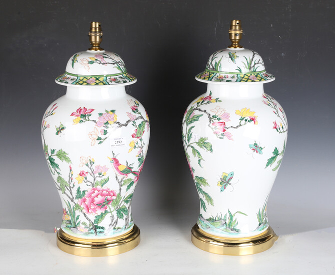 A pair of late 20th century French porcelain table lamps, decorated in the Chinese style, the unders