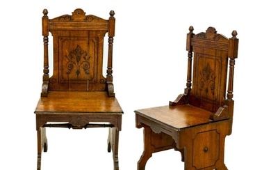 A pair of late Victorian aesthetic movement oak side chairs....