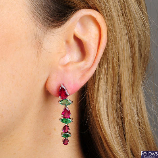 A pair of pink tourmaline and emerald asymmetric drop earrings.