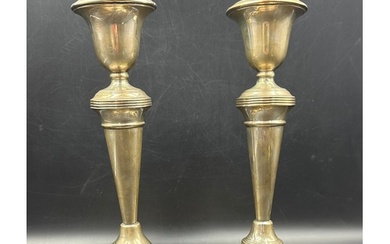 A pair of silver candlesticks, hallmarked for Birmingham 193...