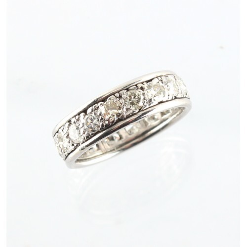 A platinum or white gold diamond eternity ring, the eighteen...
