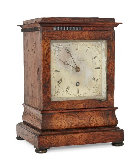 A rosewood mantel timepiece by William Johnson, Strand, London, second-quarter 19th century, the rosewood case on ogee moulding, plinth base and bun feet, the brass dial with Roman numerals and outer minute track, backplate signed Wm Johnson Strand...