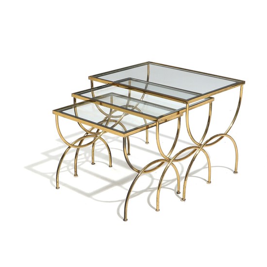 A set of three French 20th century brass nesting tables, glass tops with mirror edges. H. 39. L. 50. W. 37 cm. (3)