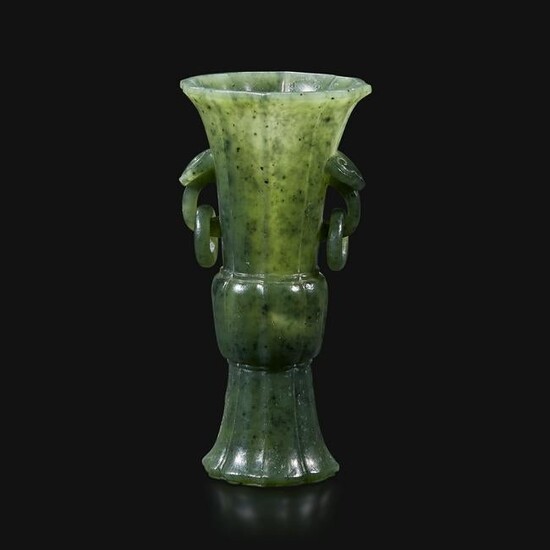 A small Chinese carved spinach green jade vase