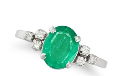 AN EMERALD AND DIAMOND RING set with an oval cut e ...