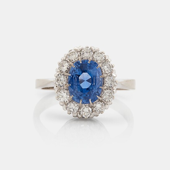 An 18K whithe gold ring set with a faceted sapphire weight 3.93 cts according to engraving
