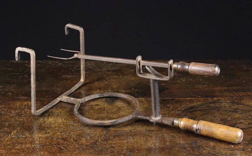 An 18th/Early 19th Century Wrought Iron Bar Gate Toaster with turned treen handles and a ringed dish