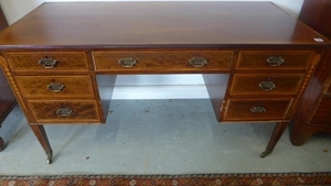 An Edwardian inlaid mahogany seven drawer dressing table sta...