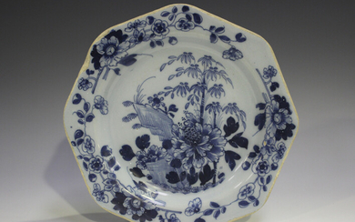An English Delft octagonal plate, 18th century, painted in blue with a chinoiserie landscape incorpo