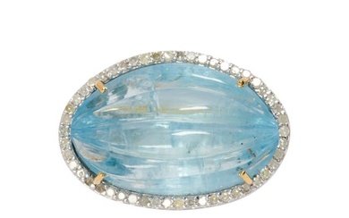 An aquamarine, diamond, silver and 14k gold ring