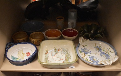 An assortment of studio pottery, some signed, mainly dishes and vases etc.