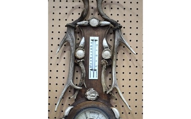 An early 20th Century wooden and antler horn Barometer and t...