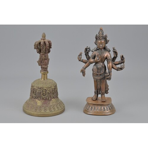An indian figure and tibetan bronze bell. figure height appr...