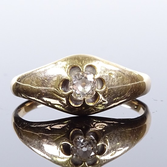 An unmarked gold solitaire diamond gypsy ring, setting heigh...