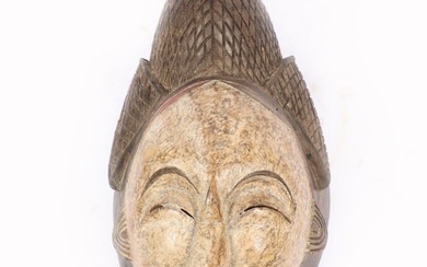 Antique Punu African Tribal carved and polychrome female mask, Gabon. 13 1/2"H x 7 1/4"W