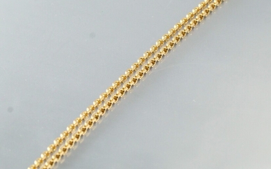 Bracelet en or 18k (750) à maille forçat Tour de cou : env. 59 cm....