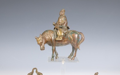 China, two bronze figures of Wise man on a horse and a buffalo, a smaller messing figure of a Chinese figure and India a bronze stamp, ca. 1900 or later;