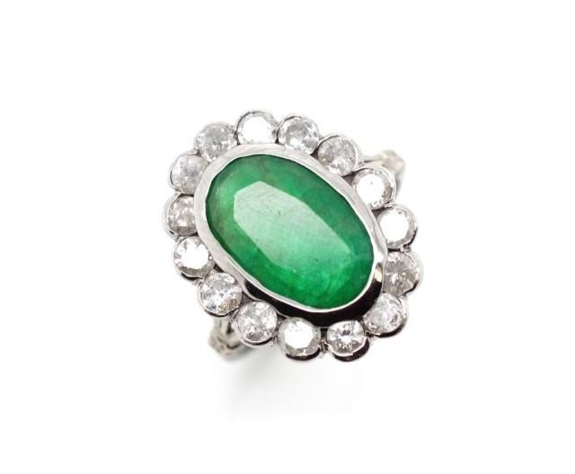 Emerald and diamond halo ring set in 18ct white gold and pal...