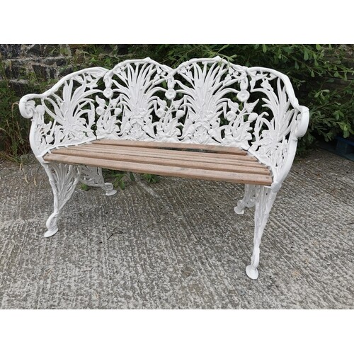 Good quality cast alloy two seater garden bench decorated wi...