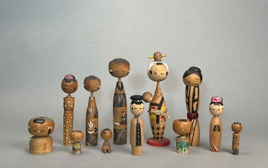 Group of Twelve Japanese Painted Wood Dolls
