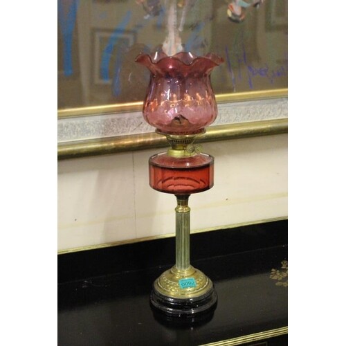 Late Victorian Cranberry Glass Oil Lamp with reeded Brass Co...