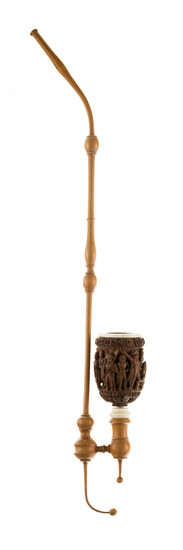 Napoléon, pipe avec fourneau sculpté en noix de corozo, France XIXe s., anneau en ivoire, tuyau en buis, h. 46 cm