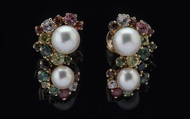 Pair of EARRINGS each decorated with two cultured pearls and a total of thirty-two fine stones including: ten red garnets, four aquamarines, two pink tourmalines, fourteen green tourmalines, two peridots mounted in claws. Alpa clasps. Diameter of the...