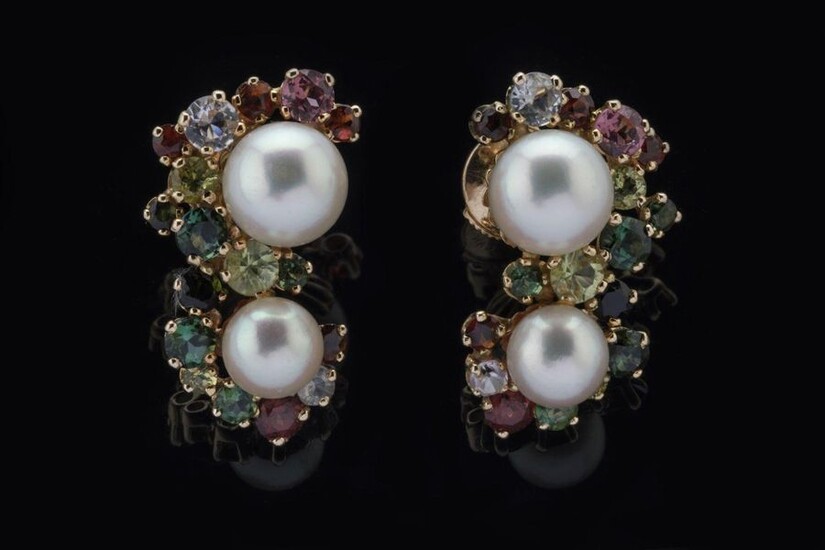 Pair of EARRINGS each decorated with two cultured pearls and a total of thirty-two fine stones including: ten red garnets, four aquamarines, two pink tourmalines, fourteen green tourmalines, two peridots mounted in claws. Alpa clasps. Diameter of the...