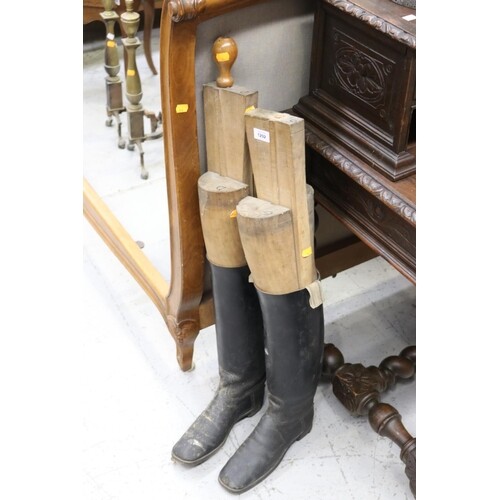 Pair of antique black leather boots with wooden stretchers i...