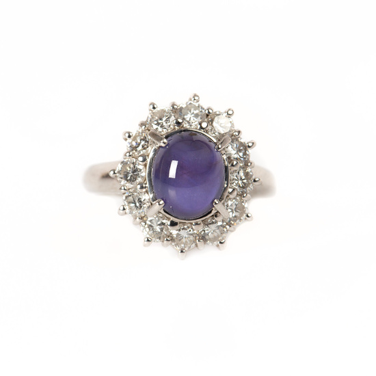RING, platinum with cabochon-cut star sapphire 4. 25 ct and brilliant-cut diamonds totaling 1. 15 ct.
