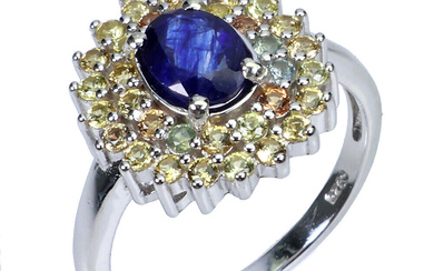 Ring of rhodium-plated sterling silver adorned with blue sapphires