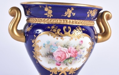 Royal Worcester two handled vase painted with roses in panel...
