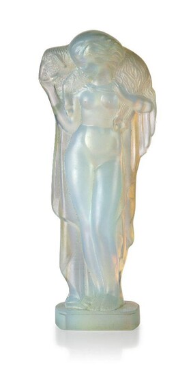 Sabino (French), an opalescent glass figure of a 'lady holding a lamb', c.1930, moulded Sabino Paris, engraved on the back of the base Sabino Paris, Moulded as a partially draped woman carrying a lamb across her shoulders, on integral base, 17.5 cm...