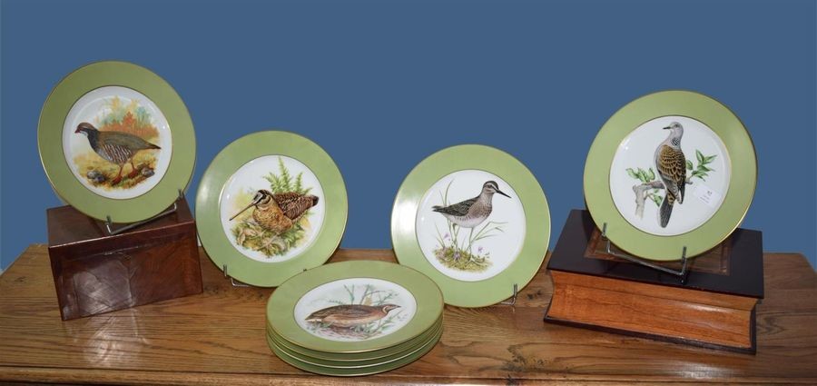 Seven Vista Alegre porcelain plates with birds decoration...