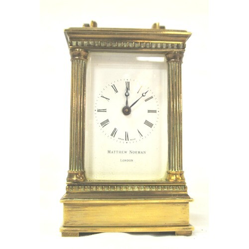Swiss brass cased small carriage clock with bevelled windows...