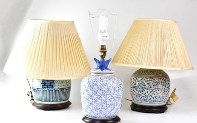 Three 20th century Chinese porcelain blue and white table lamps...