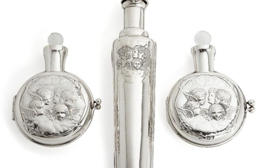 Two Victorian putti-decorated silver cased scent bottles by William Comyns, London, 1898 and 1899, 12.6cm long, together with a tapering scent bottle/flask in Victorian silver case, also decorated with putti, Birmingham, 1897, Deakin & Francis...