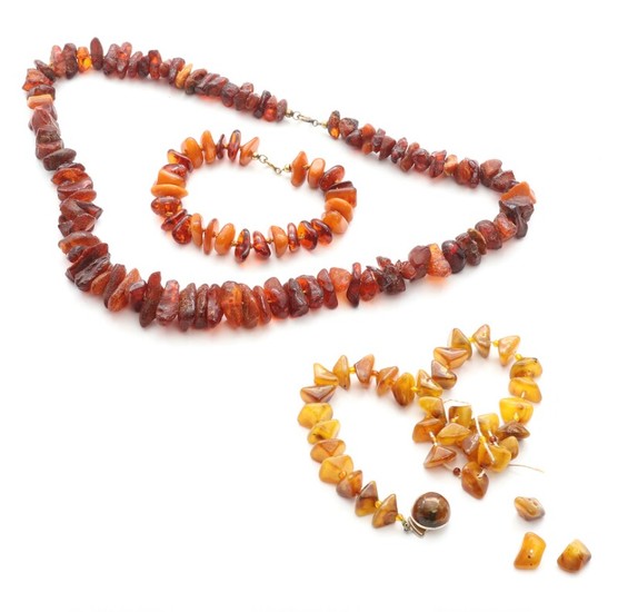 Two amber necklaces and a bracelet. Chains L. 58 and app. 34 cm. Total weight app. 92 g. (3)