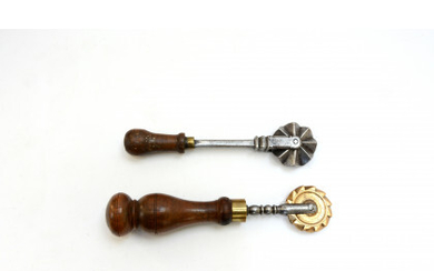 Two iron/brass pastry jiggers with wooden handles