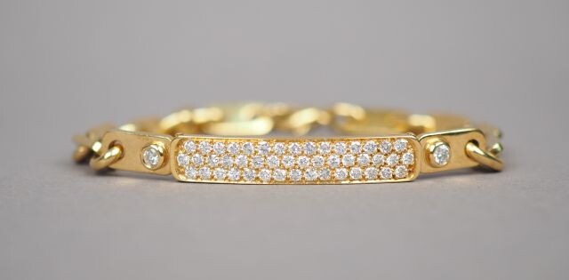 Yellow gold bracelet set with diamonds.