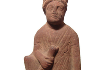 A lovely Cypriot terracotta seated figure