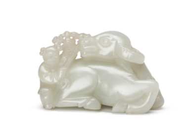 A CARVED WHITE JADE ‘WATER BUFFALO AND BOY’ GROUP, QING DYNASTY (1644-1911)
