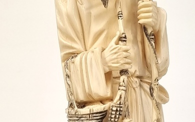A 19TH CENTURY LARGE CHINESE CARVED IVORY FIGURE OF A FISHERMAN
