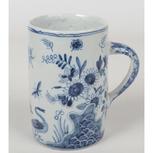 A 19th century blue and white delft cylindrical tankard with...