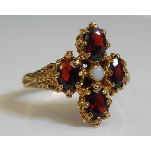 A 9ct Yellow Gold, Garnet and Opal Ring, size S, 4.6g