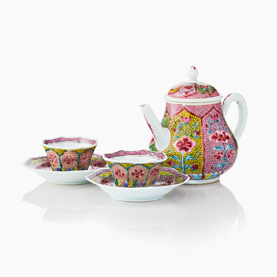 A Chinese Famille Rose Teapot and Cover and Two Cups and Saucers