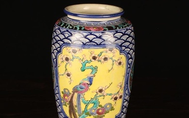A Chinese Vase with polychrome enamelled panels: one depicting a bird perched on a bough of prunus b