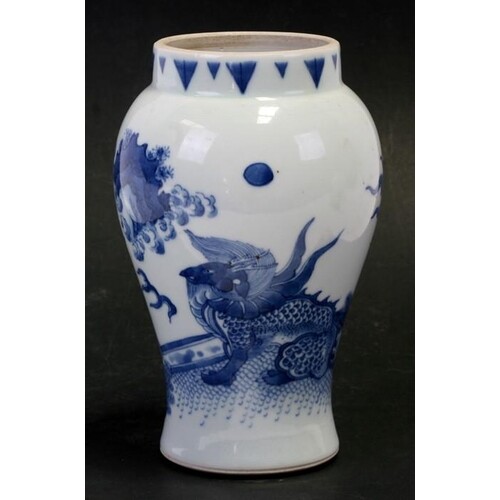 A Chinese blue and white vase decorated a dragon and bamboo,...