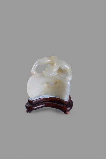 A Chinese celadon jade 'Chilong' carving