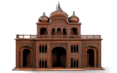 A FINELY CARVED WOOD ARCHITECTURAL OVERMANTEL, PROBABLY BY MUHAMMAD YUSUF AND NUR MUHAMMAD, SIMLA, NORTH INDIA, CIRCA 1905-1910
